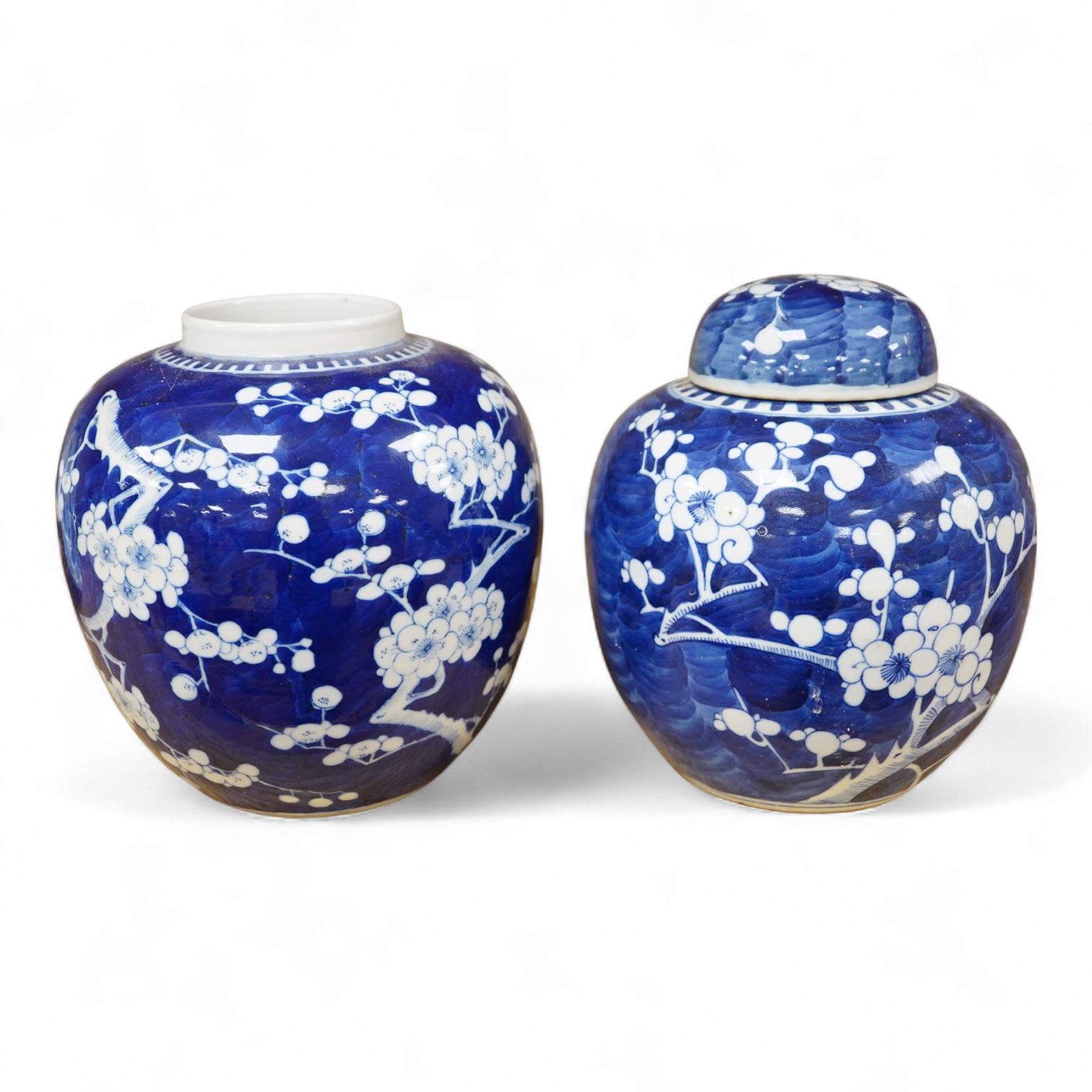 Two Chinese Prunus flower ginger jars, one with cover, 20cm high